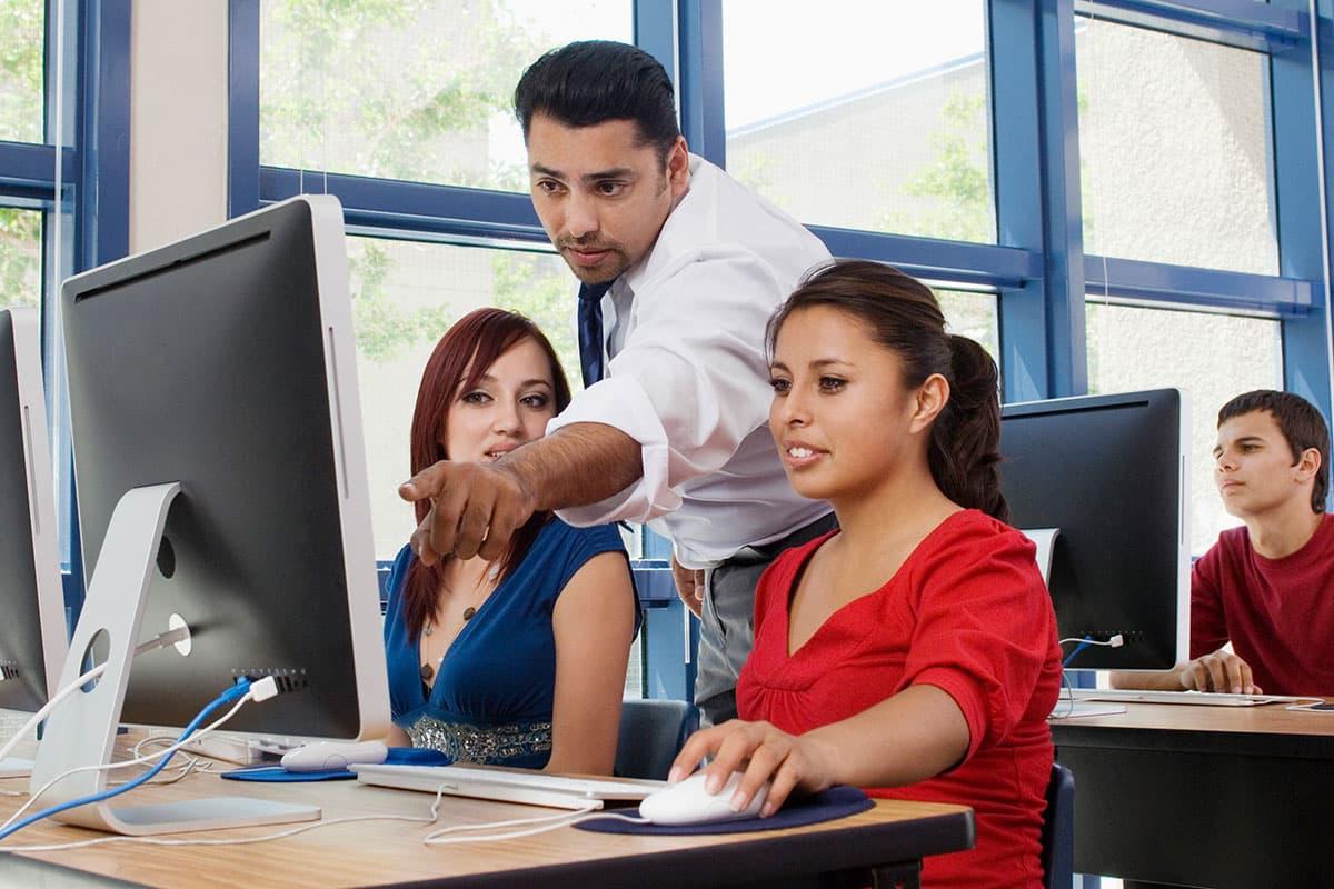 An instructor working with Teacher Education students